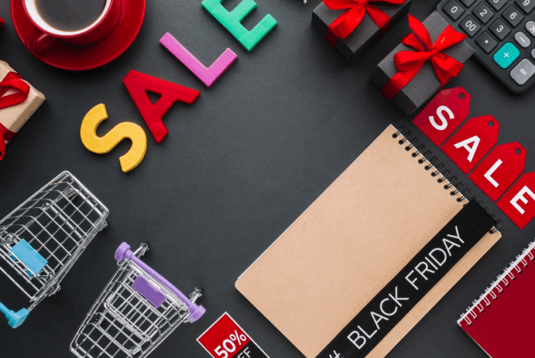 Black Friday sale flat lay with shopping carts, gifts, and discount signs representing the best time of year to buy things