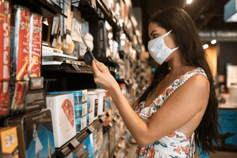 Female shopper browsing store aisle influenced by retail psychology and store layout tricks