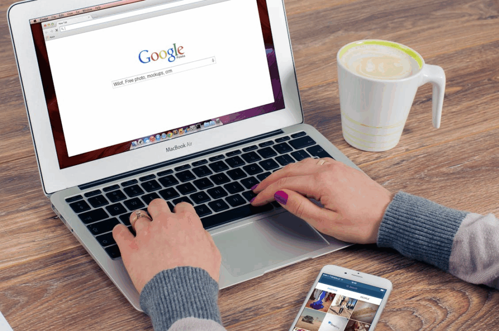 Person using a laptop and the best shopping browser extensions while online shopping.